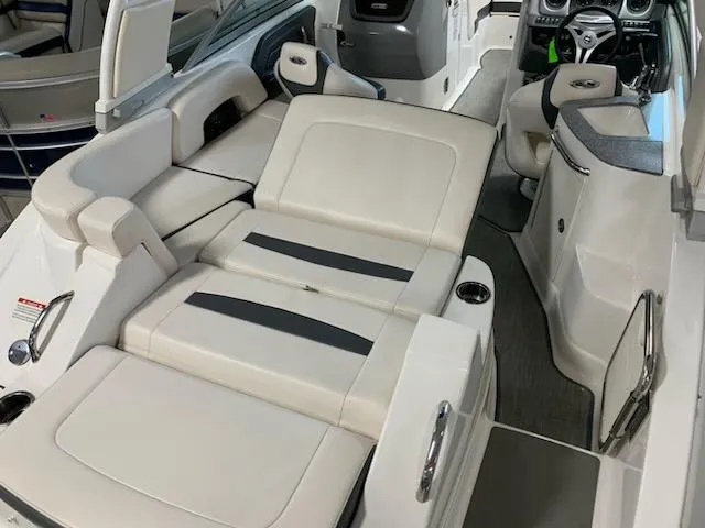 Slide: The Image of 2018 Chaparral 224 Sunesta boat interior with white seating and modern dashboard. - 4