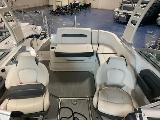 Slide: The Image of 2018 Chaparral 224 Sunesta boat interior with white seating and modern design. - 5