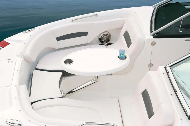 Slide: The Image of Manufacturer Provided Image: 2018 Chaparral 224 Sunesta boat interior with white seating and table. - 8