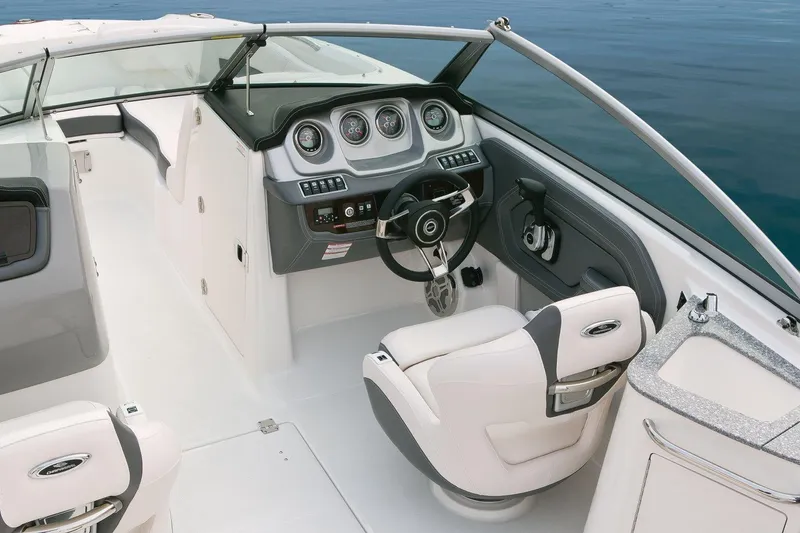 Slide: The Image of Manufacturer Provided Image: 2018 Chaparral 224 Sunesta boat cockpit with steering wheel and dashboard. - 9
