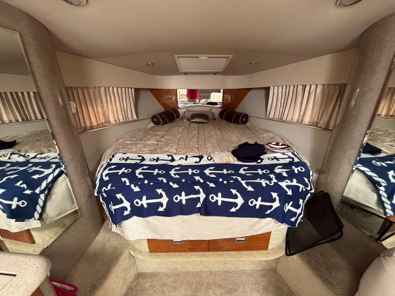 Slide: The Image of Interior of 2005 Formula 37 PC yacht with cozy bed and nautical-themed decor. - 15