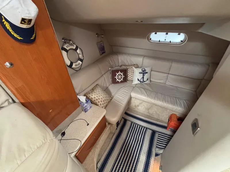 Slide: The Image of Interior of 2005 Formula 37 PC yacht with nautical decor and cozy seating area. - 16