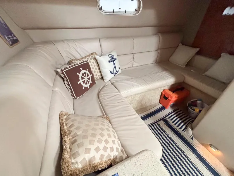 Slide: The Image of 2005 Formula 37 PC yacht interior with beige leather seating and nautical-themed pillows. - 17