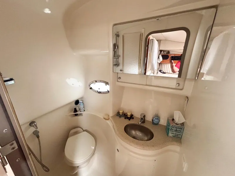 Slide: The Image of 2005 Formula 37 PC yacht bathroom with sink, toilet, and mirror. - 18