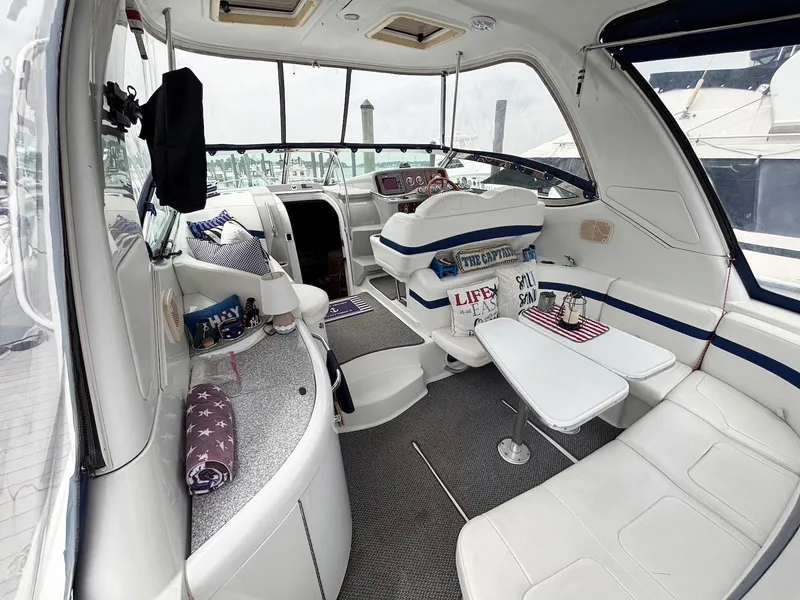 Slide: The Image of Interior of a 2005 Formula 37 PC yacht with white seating and nautical decor. - 3