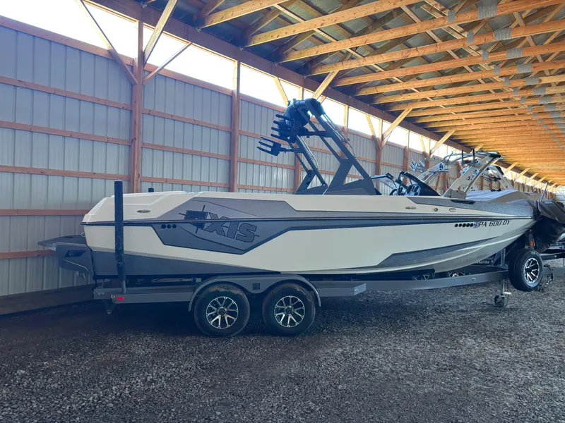 The Image of 2020 Axis T23 boat on trailer in covered storage facility. - 0