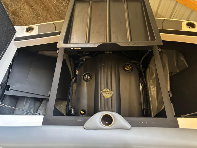 Slide: The Image of 2020 Axis T23 boat engine compartment with open cover, showcasing engine details. - 10
