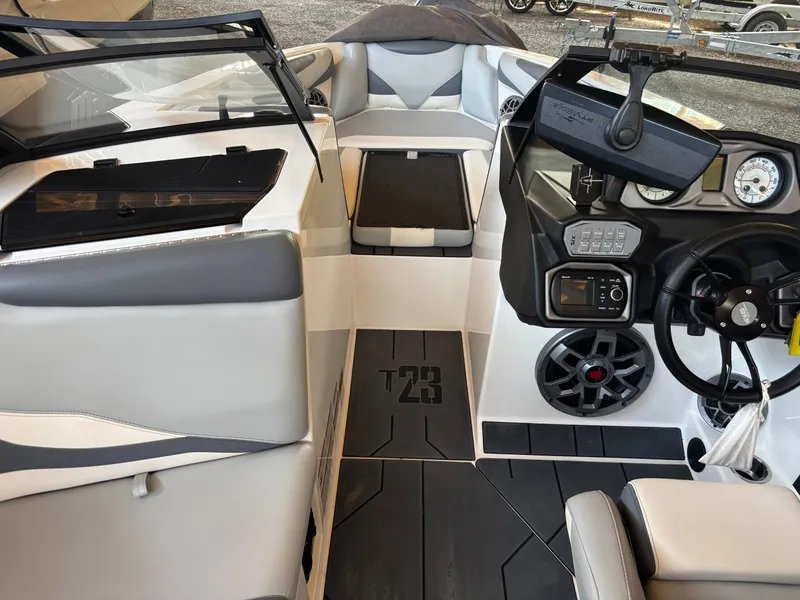 Slide: The Image of 2020 Axis T23 boat interior with modern dashboard and seating. - 4
