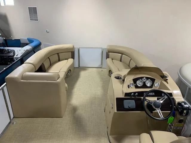 Slide: The Image of 2018 Harris Cruiser 220 interior with beige seating and steering console. - 5