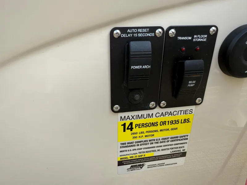 Slide: The Image of Control panel and capacity label on 2017 Manitou 24 Legacy Triple Tube boat. - 20