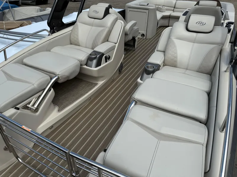 Slide: The Image of Luxurious seating on 2017 Manitou 24 Legacy Triple Tube pontoon boat interior. - 31