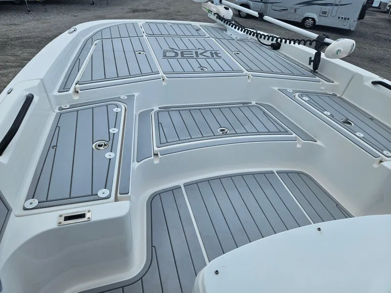 Slide: The Image of 2022 Sea Cat 260 Hybrid boat deck with gray DEKit flooring, showcasing modern design. - 10
