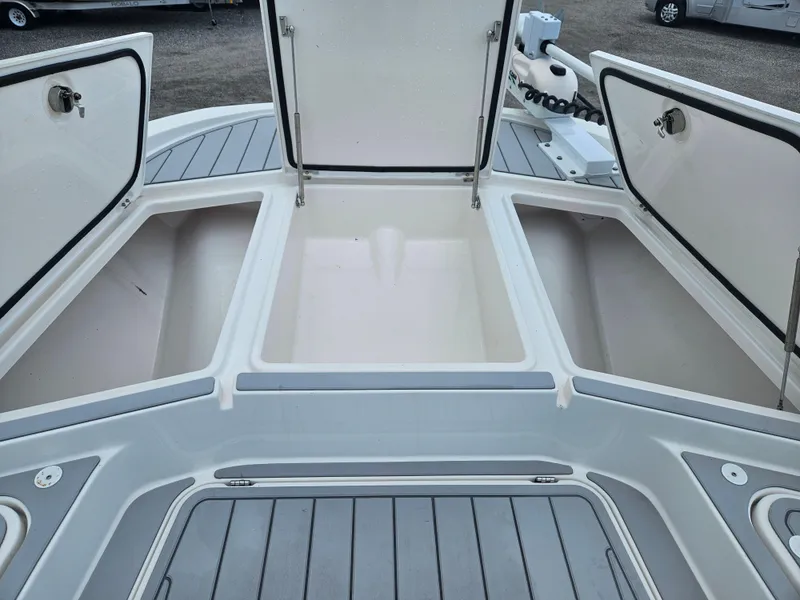 Slide: The Image of Open storage compartments on a 2022 Sea Cat 260 Hybrid boat deck. - 11