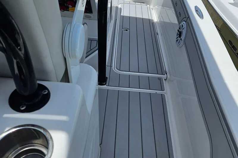 Slide: The Image of 2022 Sea Cat 260 Hybrid boat deck with sleek, modern design and integrated speaker system. - 15