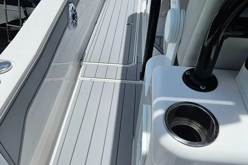 Slide: The Image of 2022 Sea Cat 260 Hybrid boat deck with cup holder and speaker. - 16