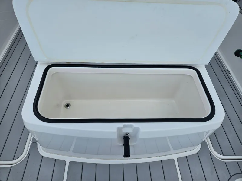 Slide: The Image of Open storage compartment on 2022 Sea Cat 260 Hybrid boat deck. - 17