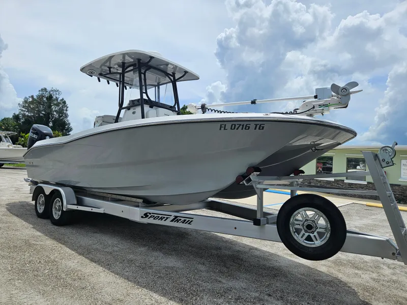 Slide: The Image of 2022 Sea Cat 260 Hybrid boat on trailer under cloudy sky. - 2