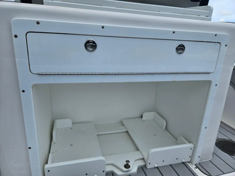 Slide: The Image of Storage compartment on a 2022 Sea Cat 260 Hybrid boat, featuring a white finish. - 22