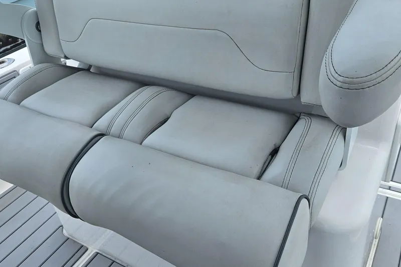 Slide: The Image of 2022 Sea Cat 260 Hybrid boat seat, featuring sleek gray upholstery and modern design. - 25