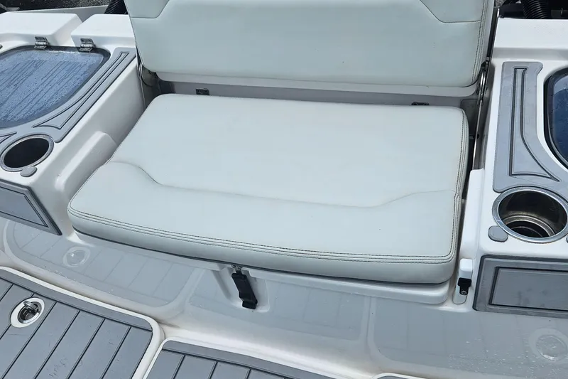 Slide: The Image of 2022 Sea Cat 260 Hybrid boat seating area with cup holders and storage compartments. - 28