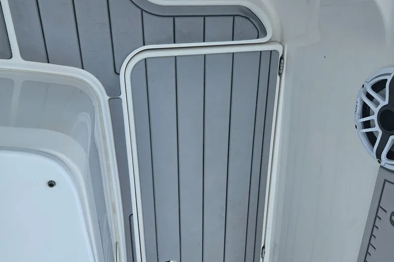 Slide: The Image of Deck of 2022 Sea Cat 260 Hybrid boat with speaker and storage compartment. - 30