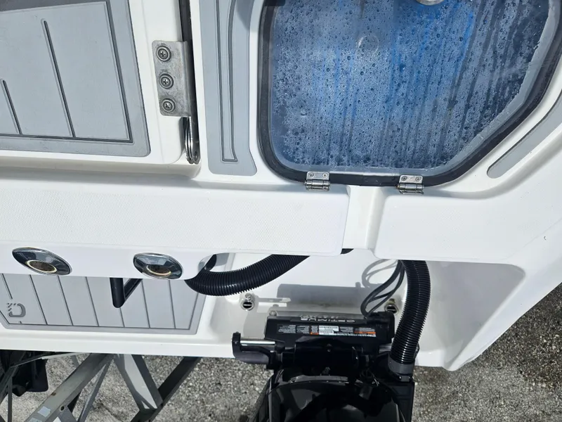 Slide: The Image of 2022 Sea Cat 260 Hybrid boat deck with storage compartment and fittings. - 32