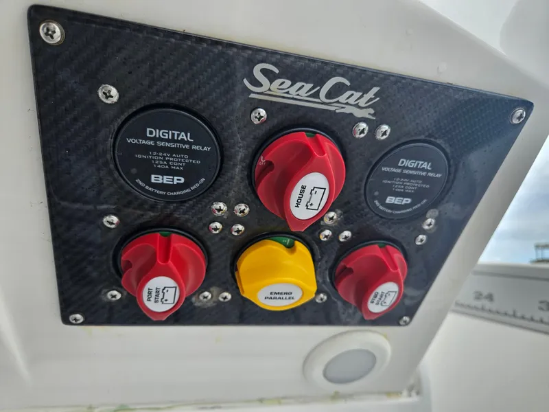 Slide: The Image of Control panel of 2022 Sea Cat 260 Hybrid boat with digital voltage sensitive relay. - 38