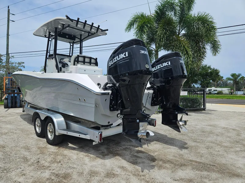 Slide: The Image of 2022 Sea Cat 260 Hybrid boat with dual Suzuki 300 engines on a trailer. - 4