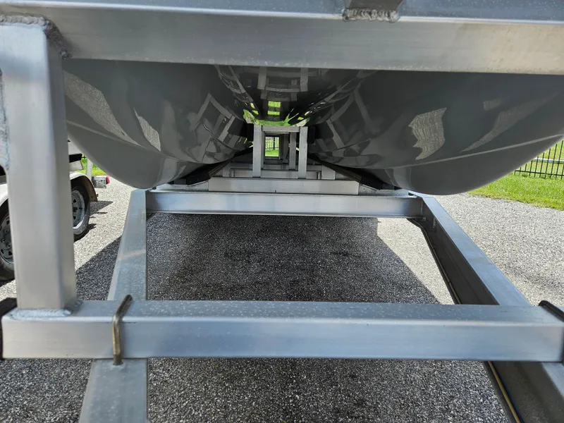 Slide: The Image of Underneath view of a 2022 Sea Cat 260 Hybrid boat on a trailer. - 41