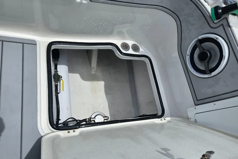 Slide: The Image of Open hatch on 2022 Sea Cat 260 Hybrid boat, showing interior compartment details. - 43