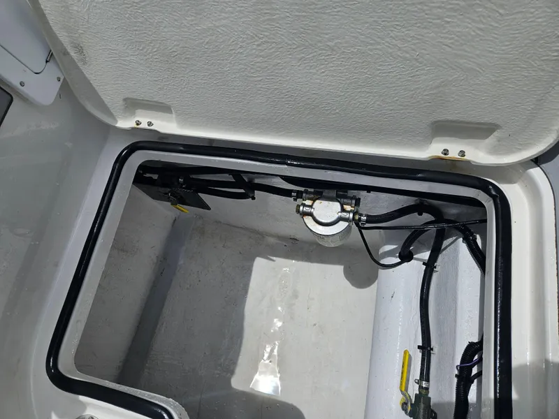 Slide: The Image of Open compartment of 2022 Sea Cat 260 Hybrid boat showing internal components and wiring. - 44