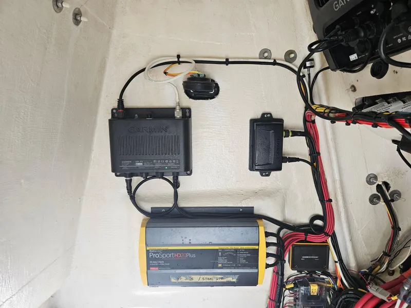 Slide: The Image of Electrical components and wiring inside a 2022 Sea Cat 260 Hybrid boat. - 47