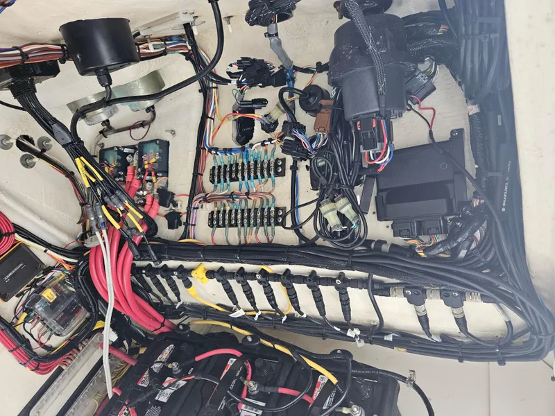 Slide: The Image of Electrical wiring and components inside a 2022 Sea Cat 260 Hybrid boat. - 49