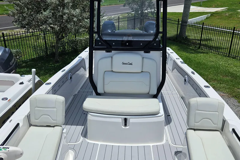 Slide: The Image of 2022 Sea Cat 260 Hybrid boat interior with white seating and sleek design. - 5