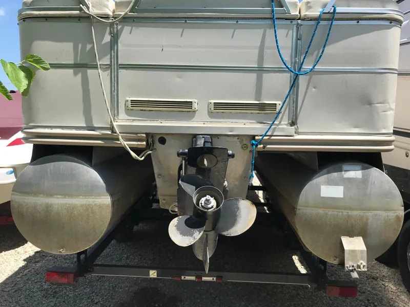 Slide: The Image of Rear view of 2000 Fisher Freedom 241 DLX pontoon boat with visible propeller. - 3