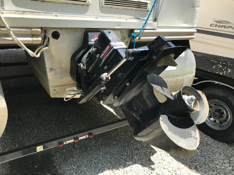 Slide: The Image of Outboard motor of 2000 Fisher Freedom 241 DLX boat on trailer. - 5