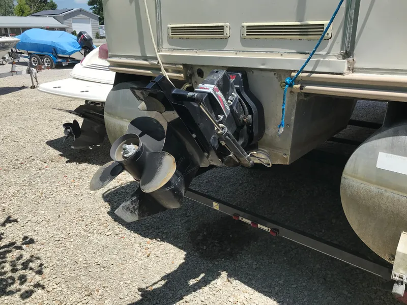 Slide: The Image of 2000 Fisher Freedom 241 DLX pontoon boat with Mercury outboard motor on trailer. - 7