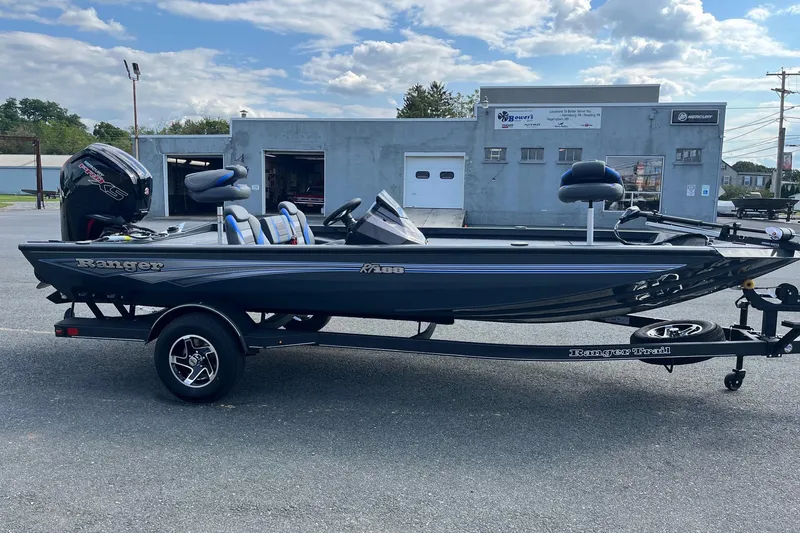 The Image of 2026 Ranger RT188 boat on trailer, parked outdoors under cloudy sky. - 0