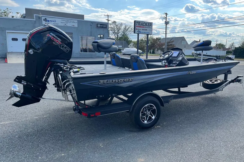 Slide: The Image of 2026 Ranger RT188 boat with Mercury engine on trailer, parked outdoors. - 3