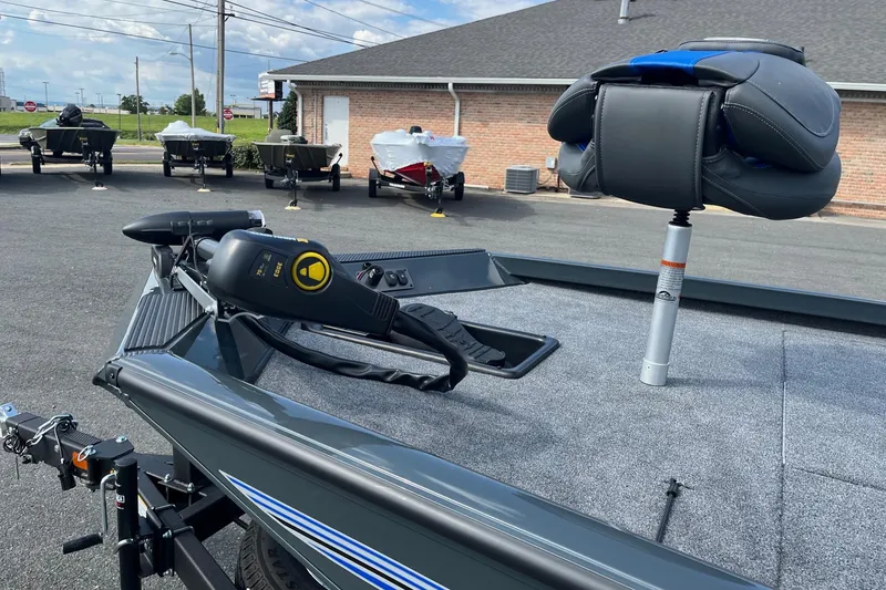 Slide: The Image of 2026 Ranger RT188 boat with trolling motor and seat, parked outdoors. - 9