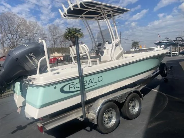 Slide: The Image of 2023 Robalo 206 Cayman boat interior with steering console and seating. - 3