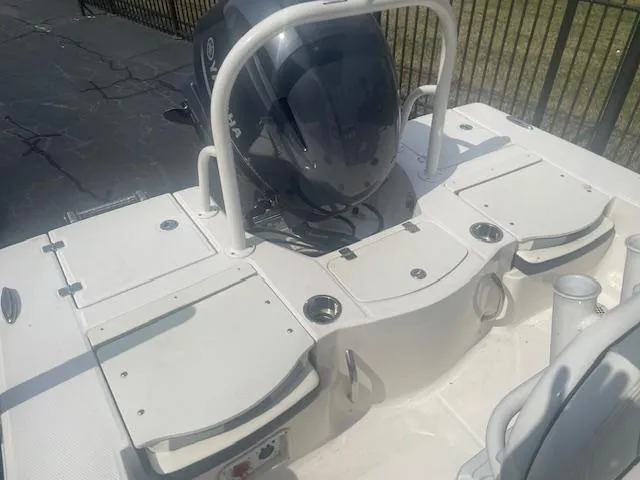 Slide: The Image of 2023 Robalo 206 Cayman boat interior with seating and console, viewed from above. - 7