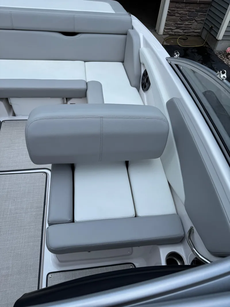 Slide: The Image of 2021 Regal 1900 ES boat interior with gray and white seating. - 11