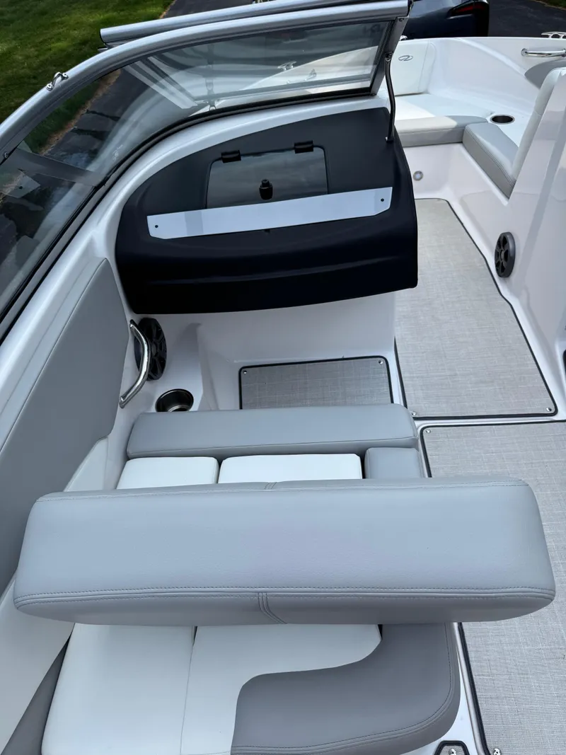 Slide: The Image of 2021 Regal 1900 ES boat interior with gray seating and sleek design. - 17