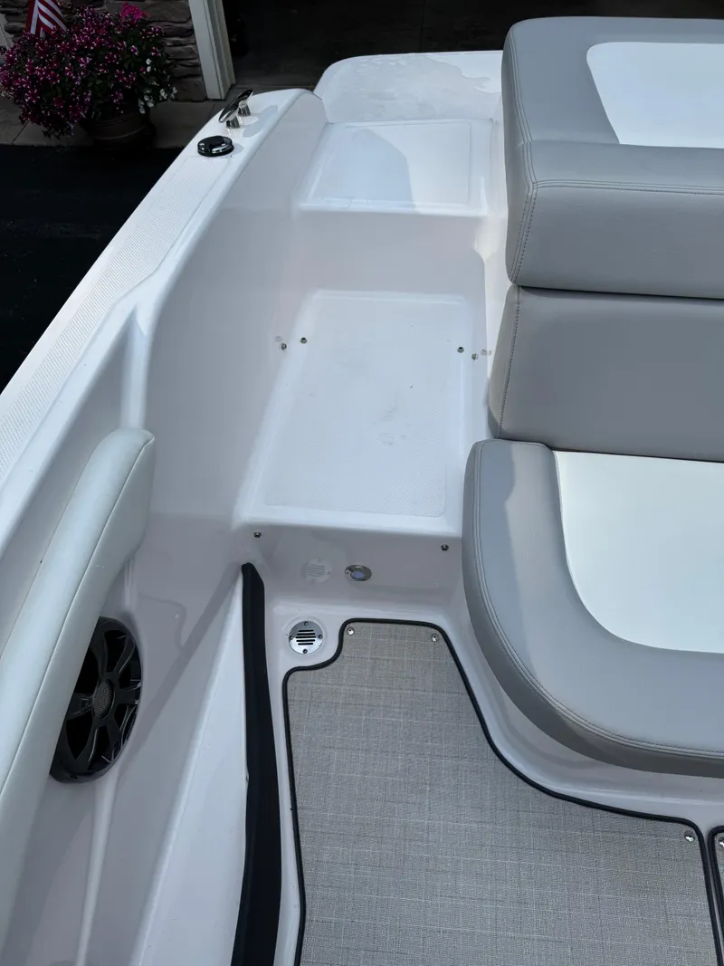 Slide: The Image of Interior of a 2021 Regal 1900 ES boat with gray seating and flooring. - 18