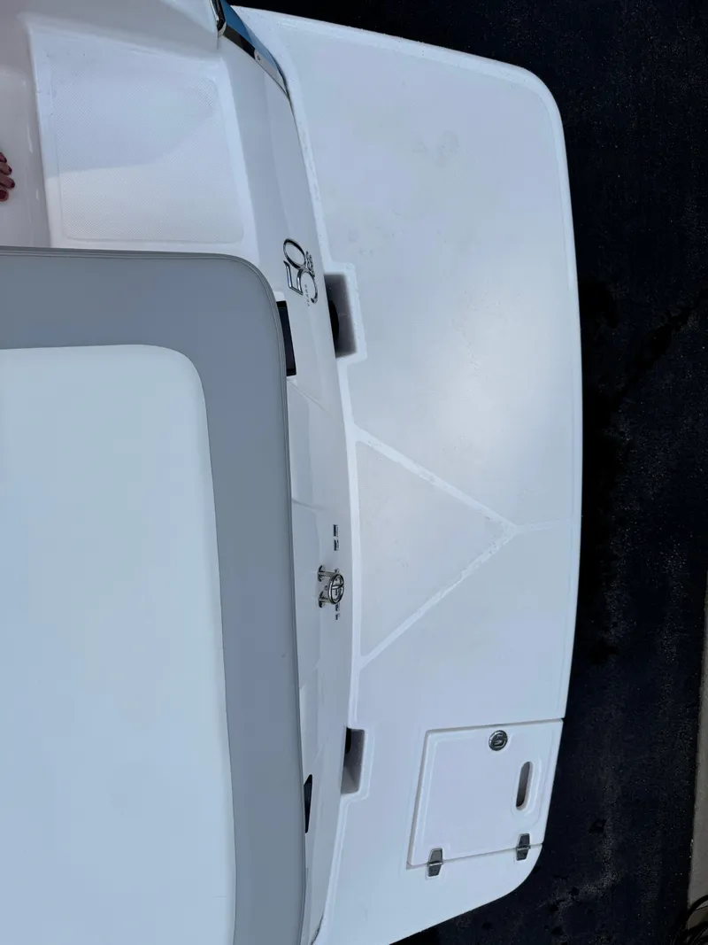 Slide: The Image of 2021 Regal 1900 ES boat's white deck and seating area, top view. - 19