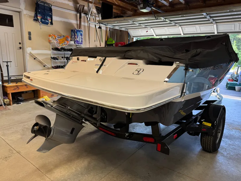 Slide: The Image of 2021 Regal 1900 ES boat in garage, covered and on trailer. - 4