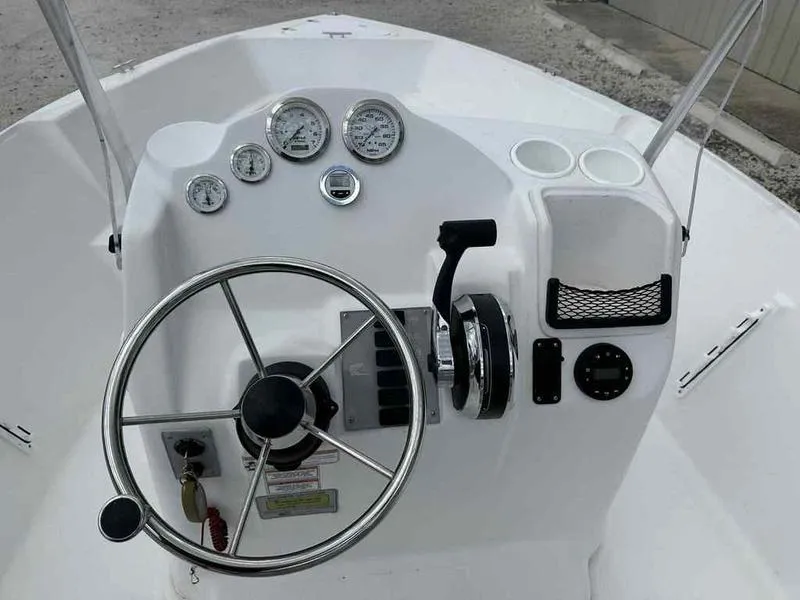 Slide: The Image of Steering console of 2022 Kenner 18 CRS boat with gauges and controls. - 8