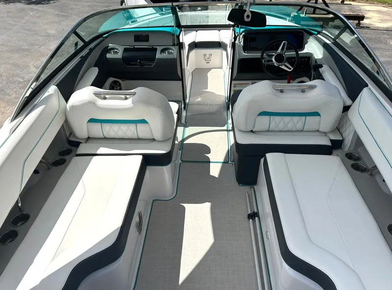 Slide: The Image of 2022 Regal LS4 Surf boat interior with white seating and modern dashboard. - 41