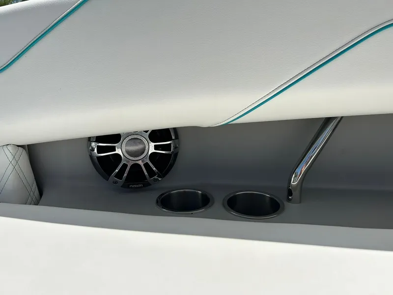 Slide: The Image of 2022 Regal LS4 Surf boat interior with speaker and cup holders. - 45